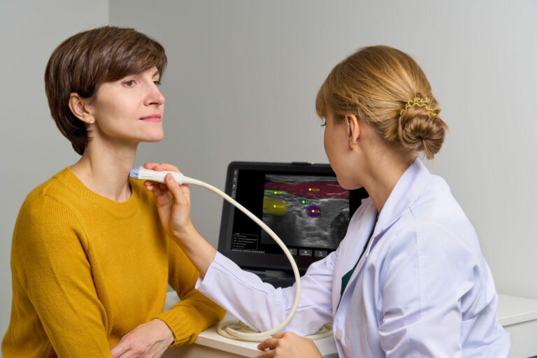 Faceless,Medical,Worker,Conducting,Thorough,Scan,Of,Cervical,Veins,And